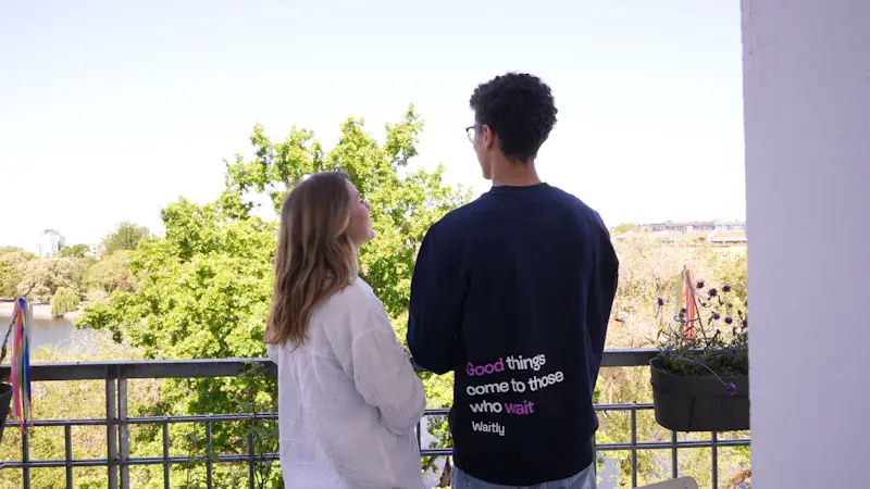 Couple on balcony looking over Berlin